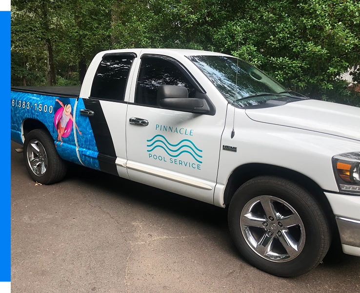 A truck featuring a blue and white design, parked against a neutral background - mobile