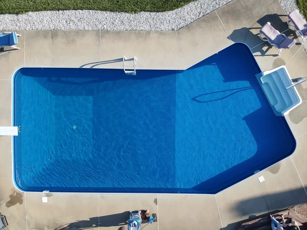 Same pool after renovation with new blue liner and filled with water