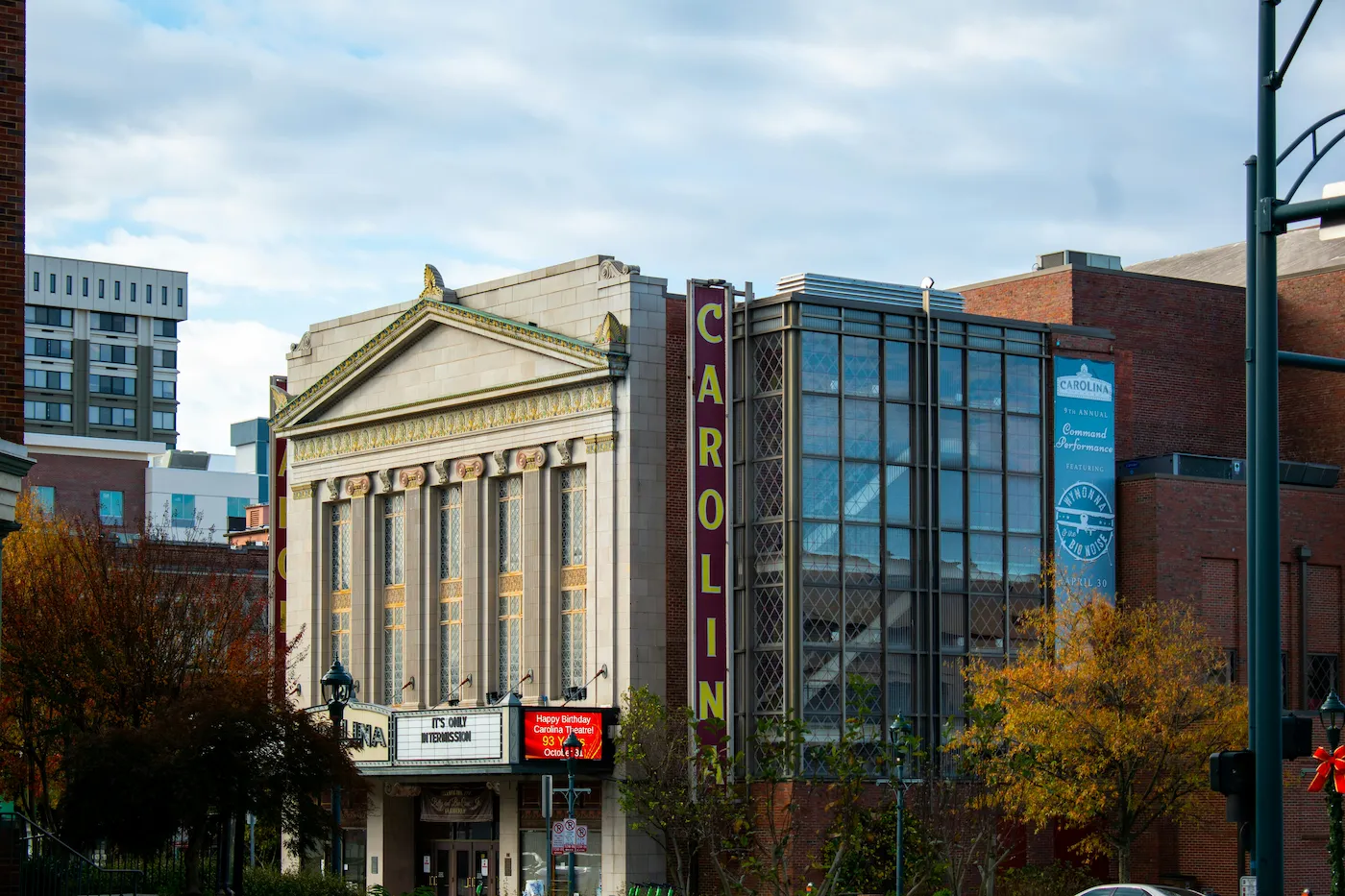 A large building featuring a prominent sign at the front, indicating its purpose or name.