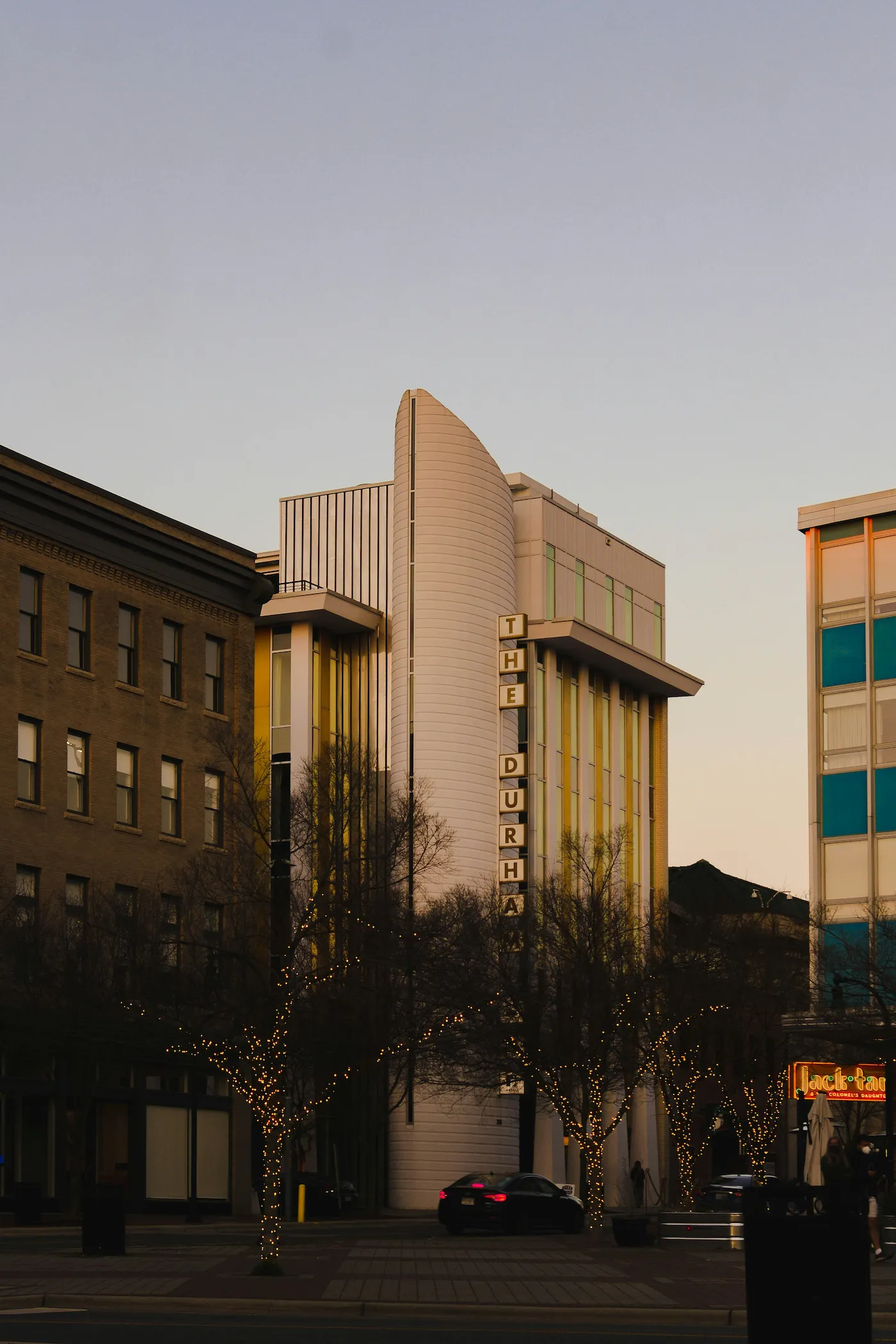 A building featuring a prominent clock on its facade, showcasing architectural details and timekeeping function.